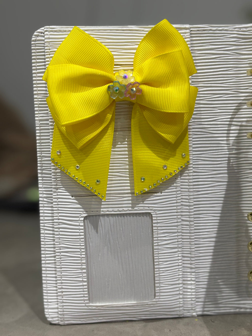 Bright yellow binder bow clip