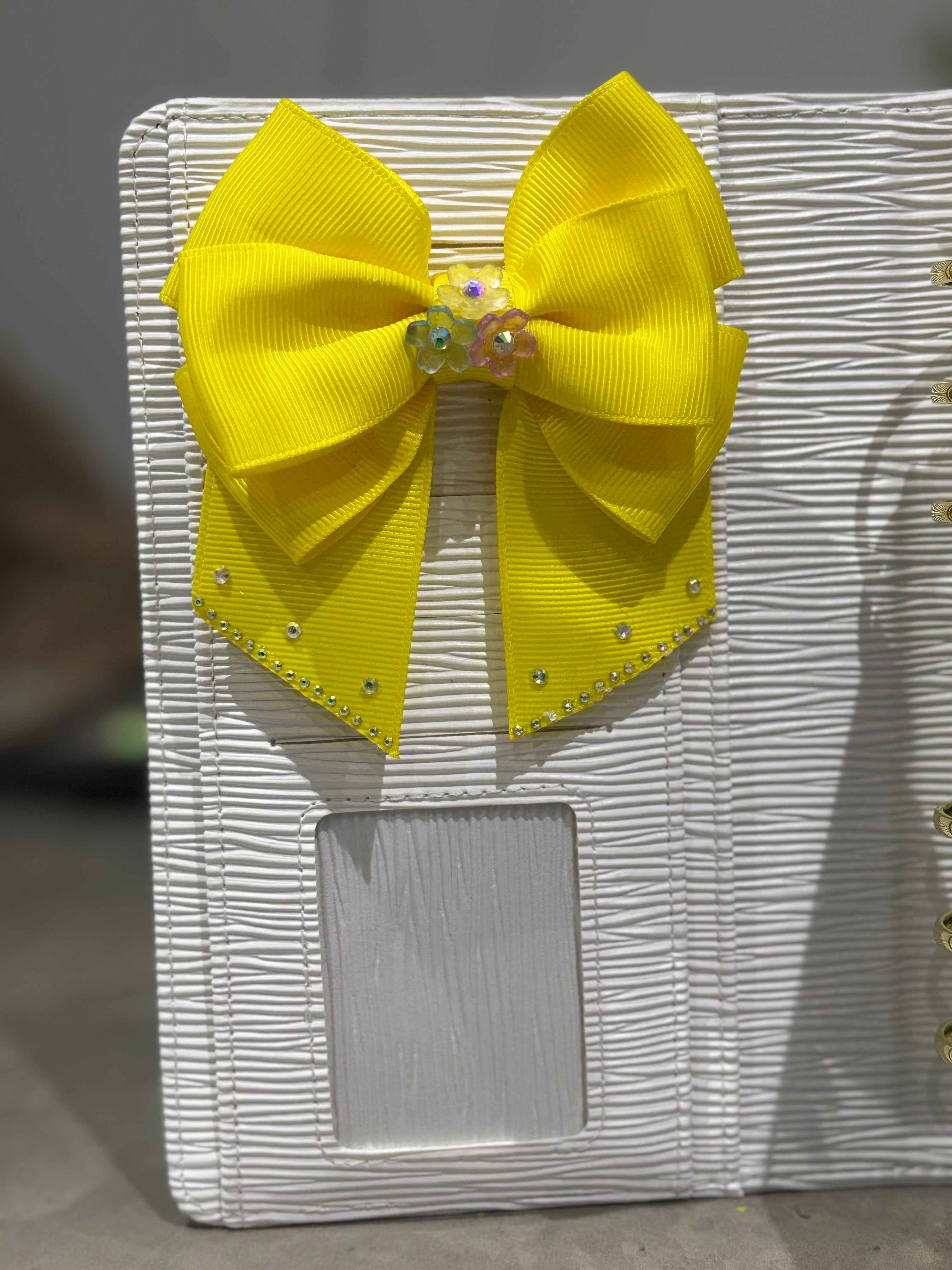 Bright yellow binder bow clip