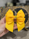 Bright orange binder bow clip
