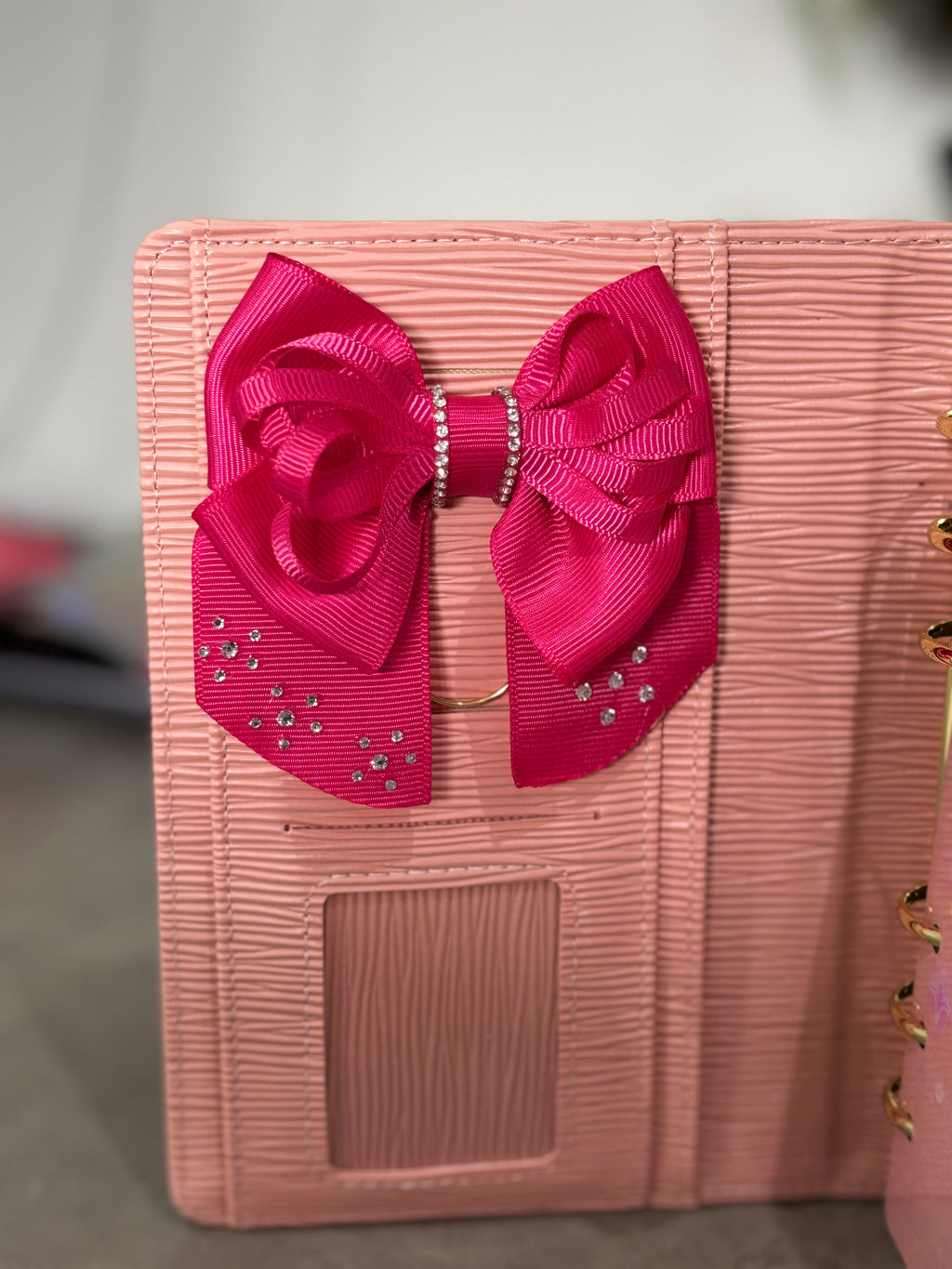 Dark pink bow binder clip