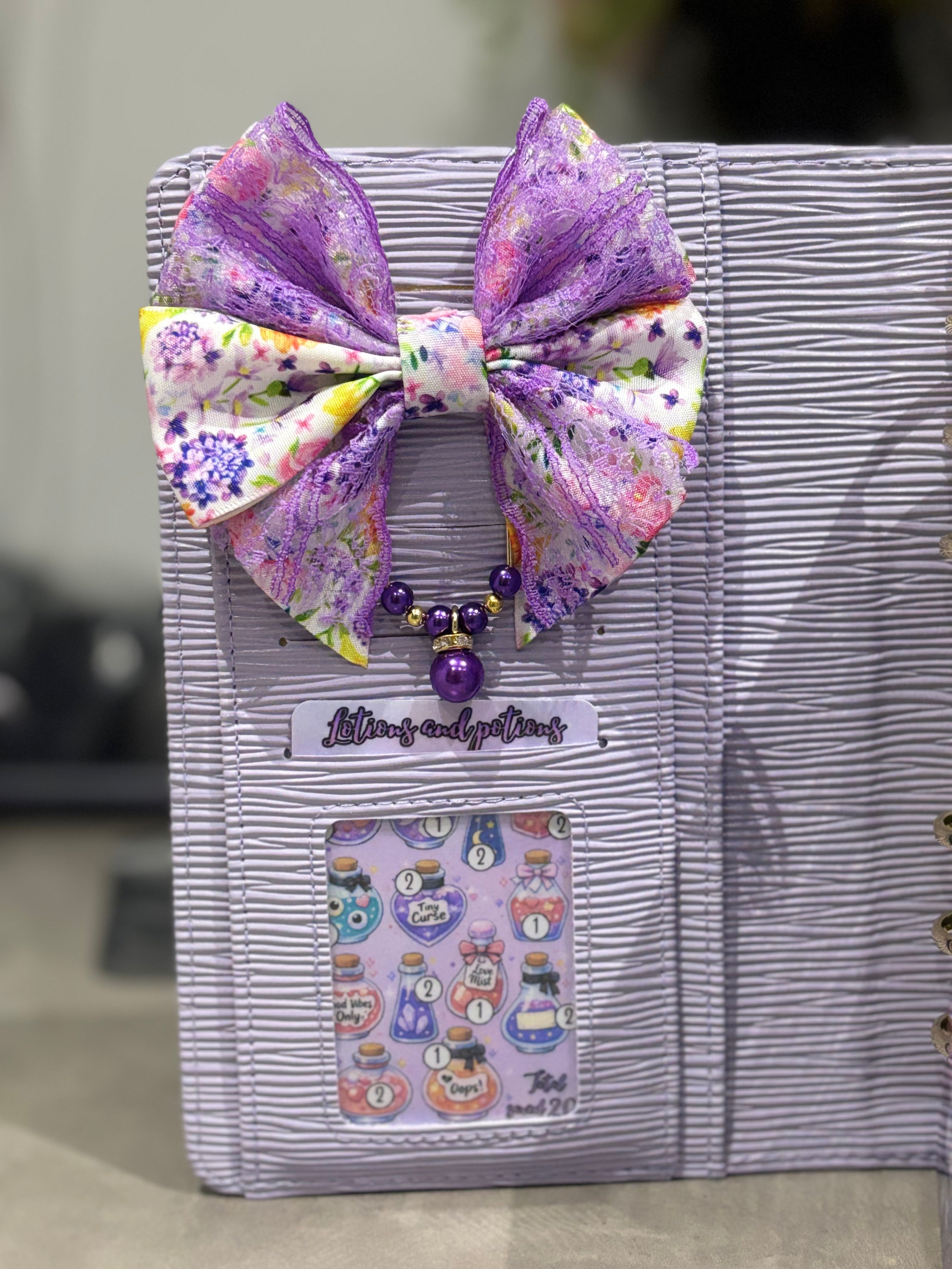 Purple flower bow binder clip