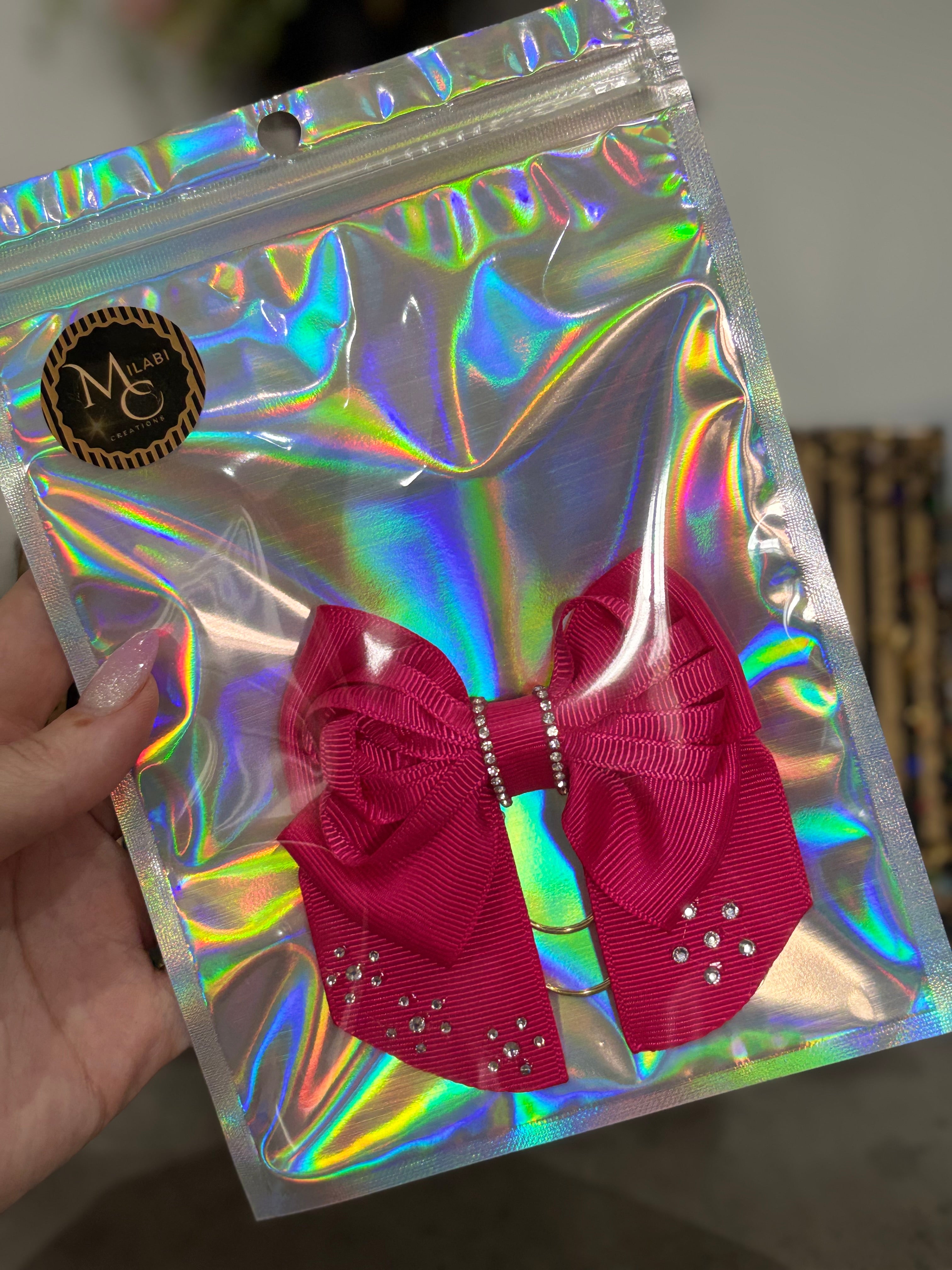 Dark pink bow binder clip
